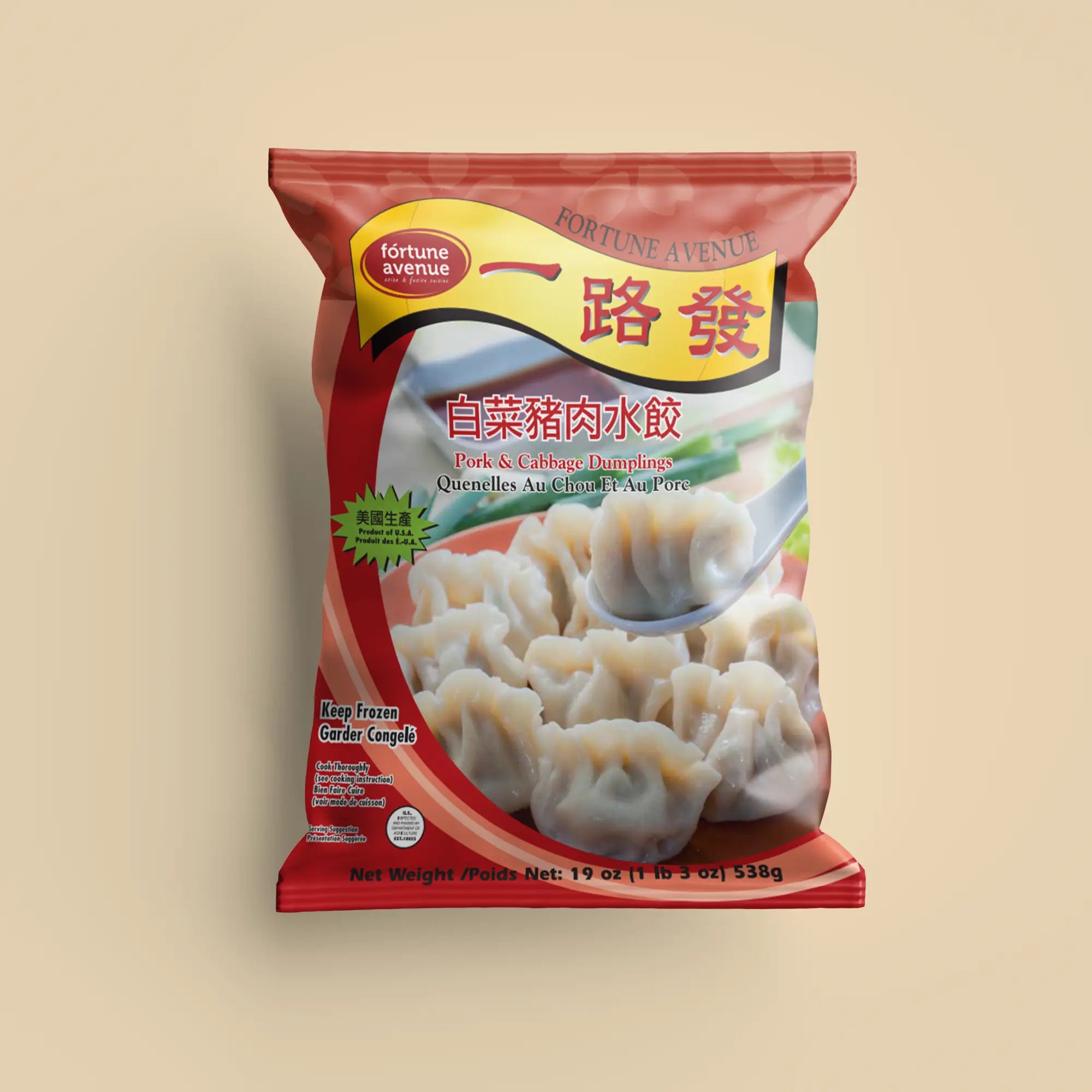 Packaging for Fortune Avenue Pork & Cabbage Dumplings, featuring a plate of dumplings with one lifted by a spoon, labeled in English and Chinese with a red design and product of U.S.A. badge.