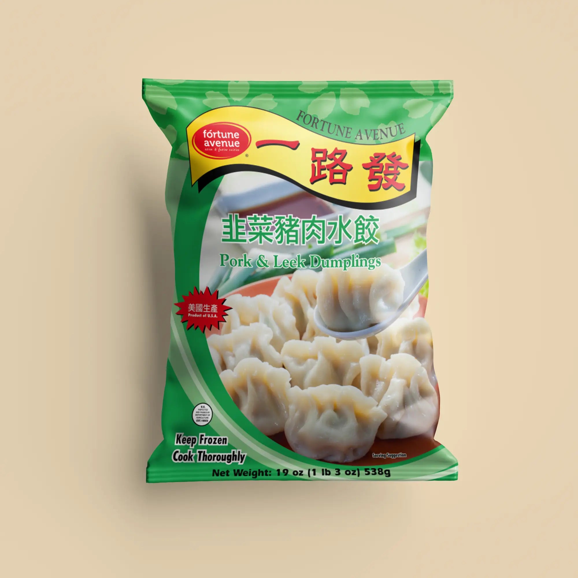 Packaging for Fortune Avenue Pork & Leek Dumplings, featuring a plate of dumplings with one lifted by a spoon, labeled in English and Chinese with a green design and product of U.S.A. badge.
